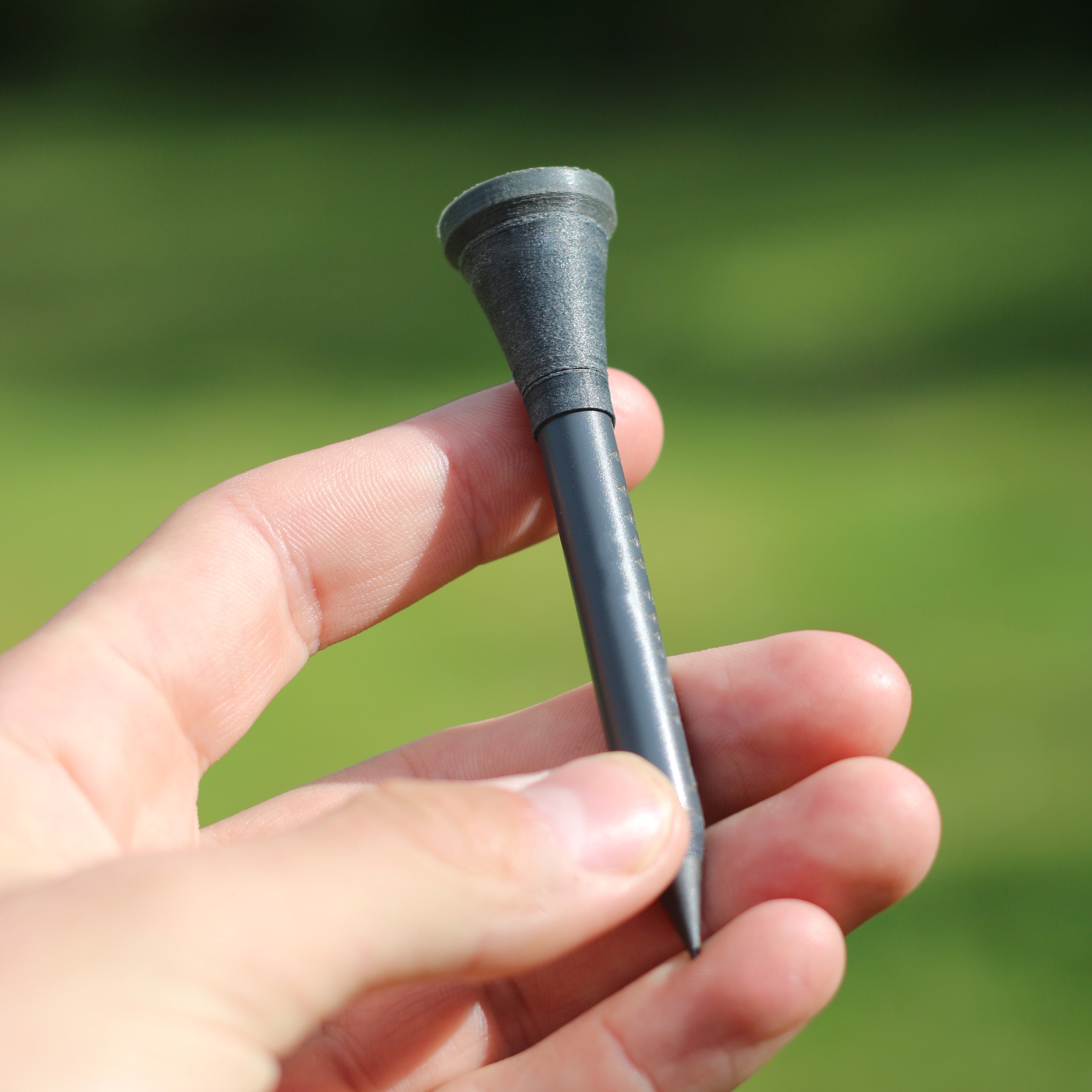 6-in-1 Golf Tool – Matte Gray Golf Tee with Club Groove Cleaner, Rangefinder, Phone Stand, Pencil, Ball Marker & Green Slope Meter